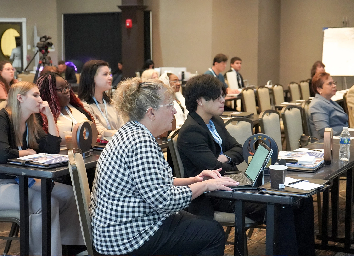Students reviewing detailed research posters