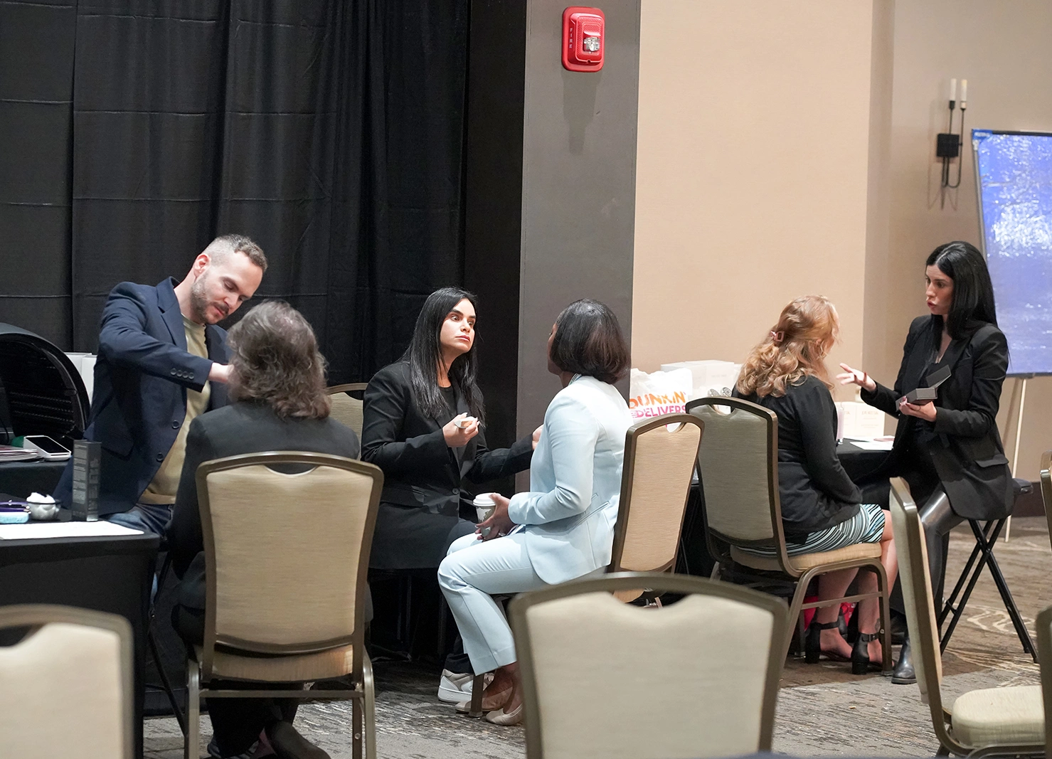 Professionals exchanging business cards