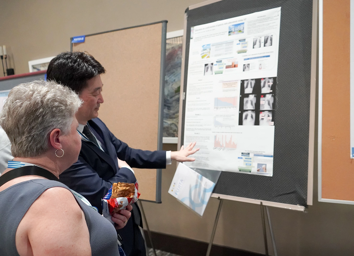 Audience listening to a speaker on stage